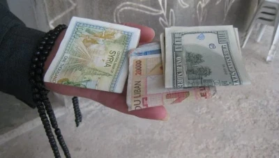 محللون يكشفون مصير الليرة السورية