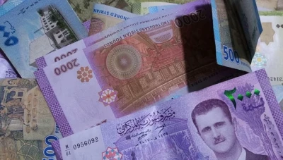 الليرة السورية تفتتح أبوابها على تحسن ملحوظ