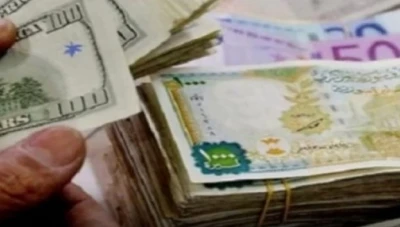 تراجع طفيف لليرة السورية أمام الدولار