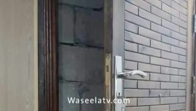 جار يسجن جاره ببناء جدار على منزله باللاذقية